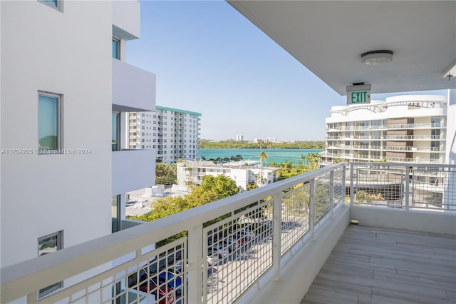 balcony featuring a water view