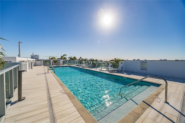 view of pool featuring a patio area