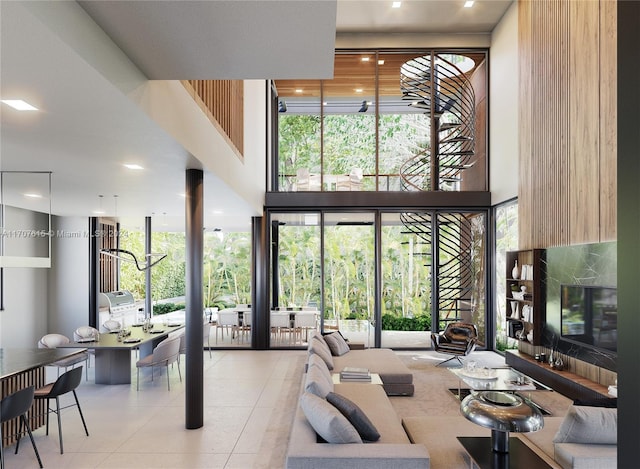 living room with a healthy amount of sunlight and a high ceiling