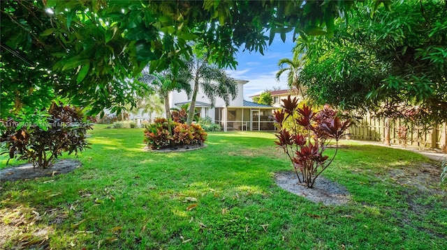 view of yard with a sunroom