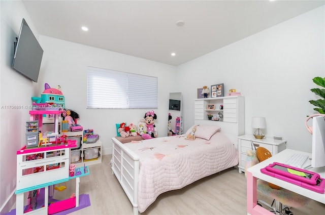 bedroom with light hardwood / wood-style floors