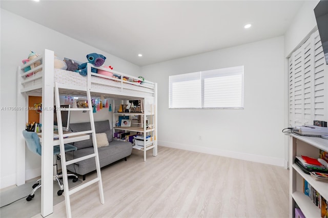 bedroom with light hardwood / wood-style floors