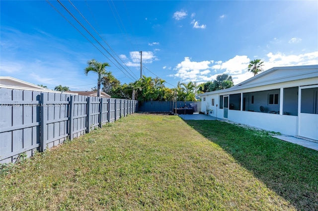 view of yard featuring a sunroom