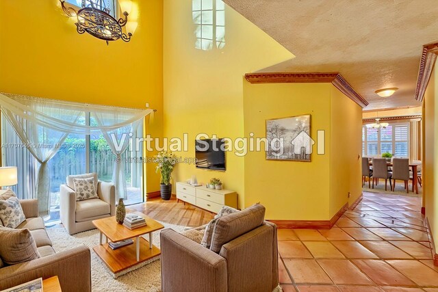 entryway with tile patterned floors and a high ceiling