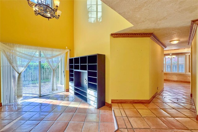 interior space featuring a chandelier and tile patterned flooring