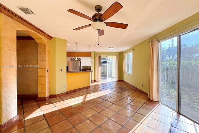 unfurnished room featuring a notable chandelier, crown molding, and a tray ceiling