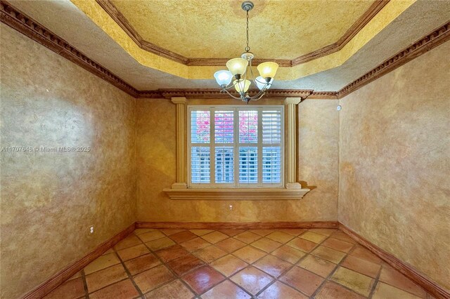 bathroom with tile patterned flooring, vanity, a textured ceiling, and crown molding