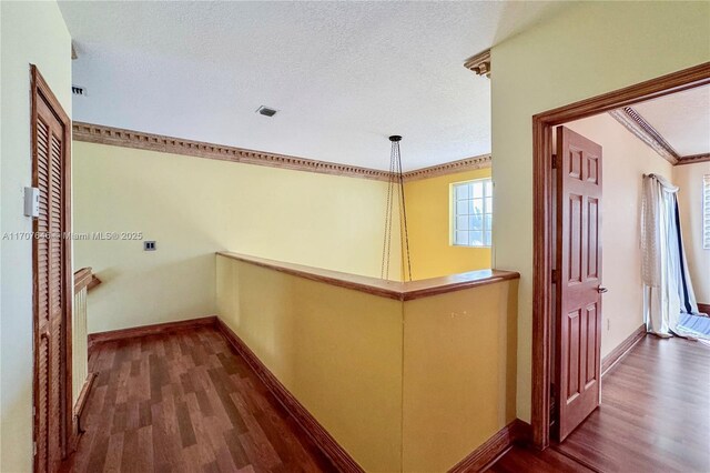 unfurnished room with a wealth of natural light, ceiling fan, dark hardwood / wood-style floors, and ornamental molding