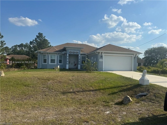 view of front facade with a garage and a front yard