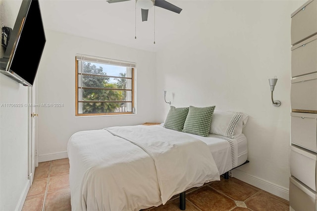 tiled bedroom with ceiling fan