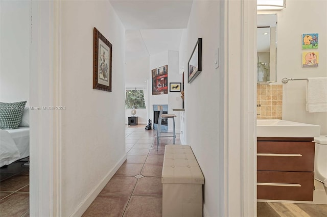 corridor with light tile patterned floors