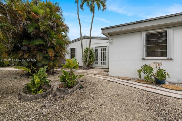 view of side of home featuring french doors