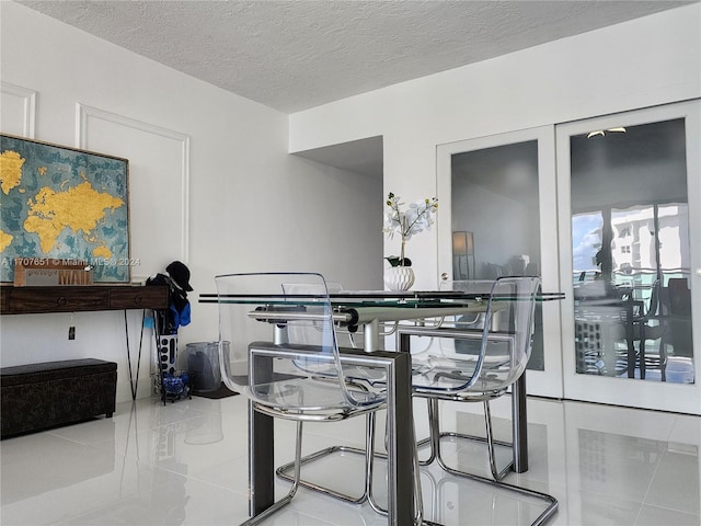 dining room featuring a textured ceiling