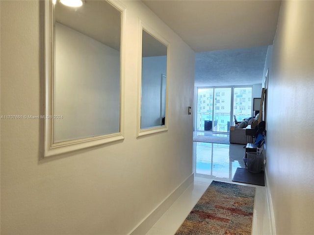 hallway featuring tile patterned flooring