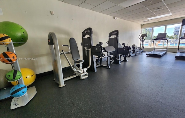 gym featuring a drop ceiling