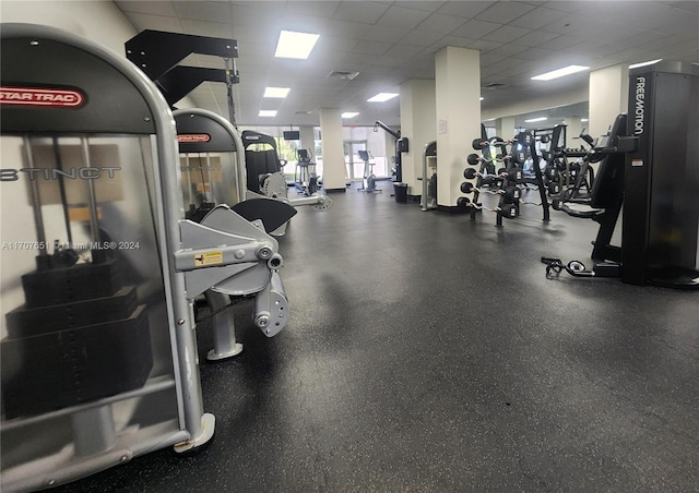 exercise room featuring a drop ceiling