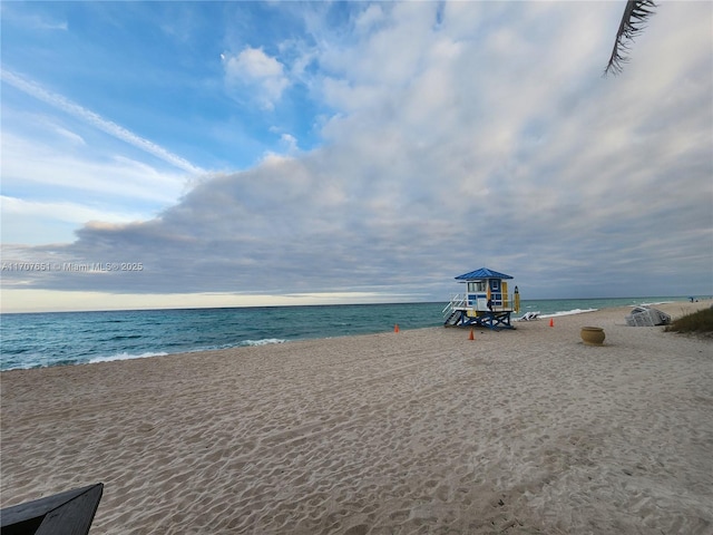 property view of water featuring a beach view