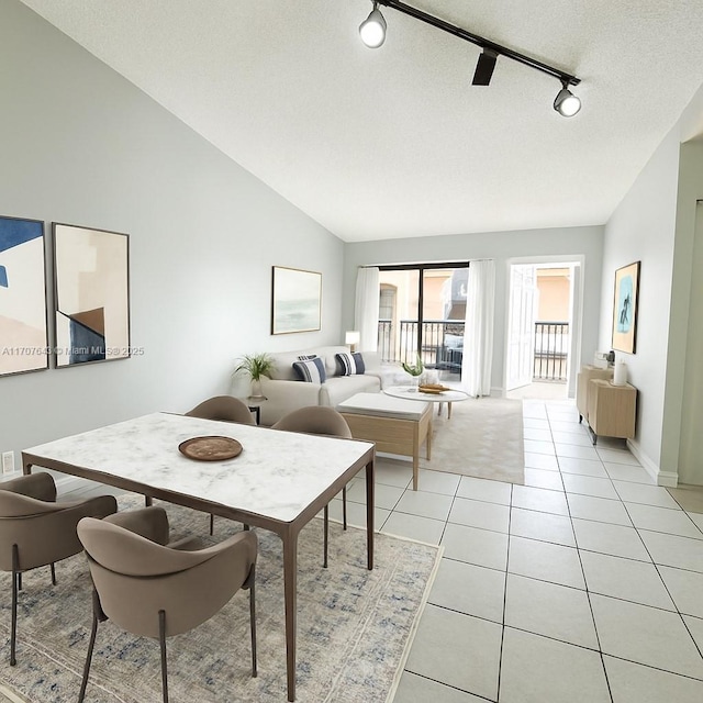 18250 Mediterranean Blvd Unit 8-15 15-8, Hialeah, FL 33015 - dining area featuring rail lighting, lofted ceiling, light tile patterned flooring, and a textured ceiling