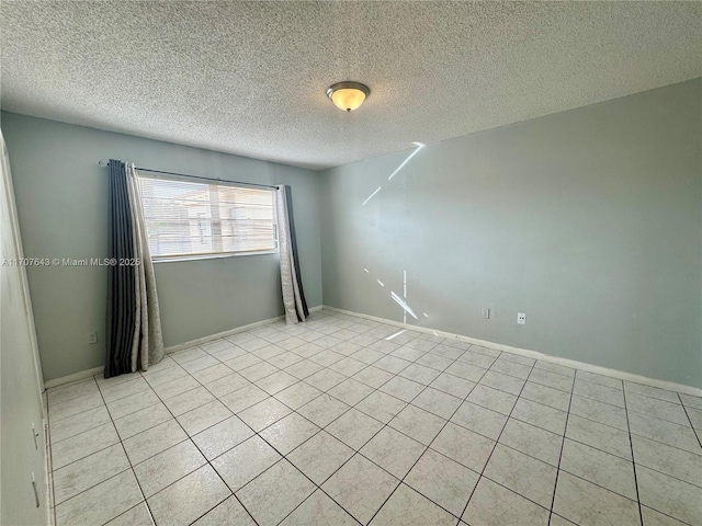18250 Mediterranean Blvd Unit 8-15 15-8, Hialeah, FL 33015 - spare room featuring light tile patterned floors and a textured ceiling