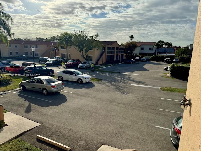 18250 Mediterranean Blvd Unit 8-15 15-8, Hialeah, FL 33015 - uncovered parking lot featuring a residential view