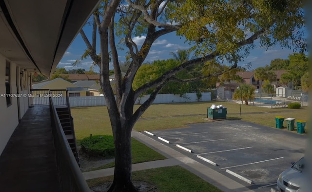 exterior space featuring a lawn and a fenced in pool