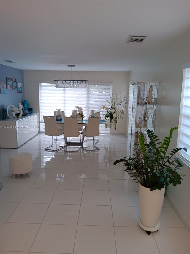 dining area featuring light tile patterned floors