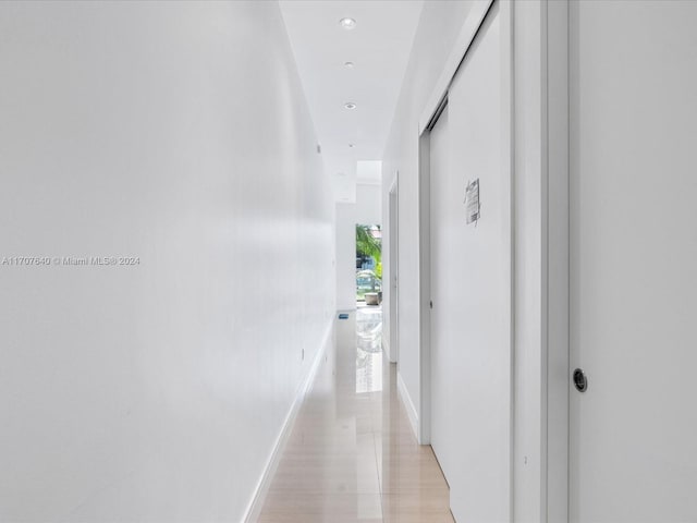 hallway featuring light tile patterned floors