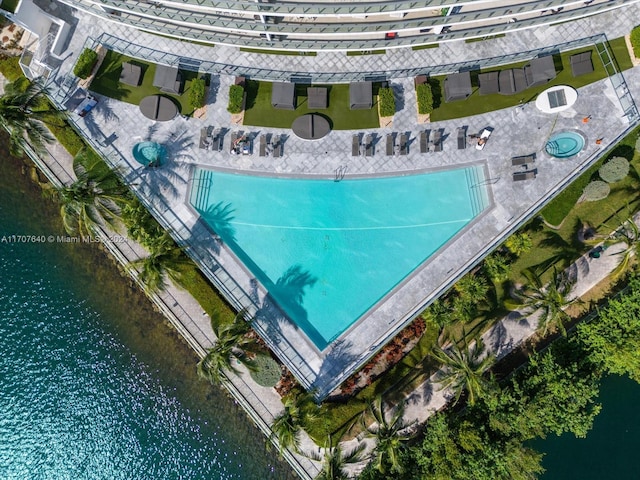 birds eye view of property featuring a water view