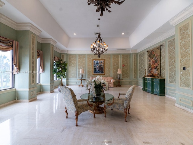 dining room featuring a notable chandelier and a raised ceiling