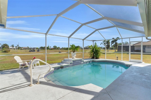 view of pool featuring a yard, glass enclosure, and a patio