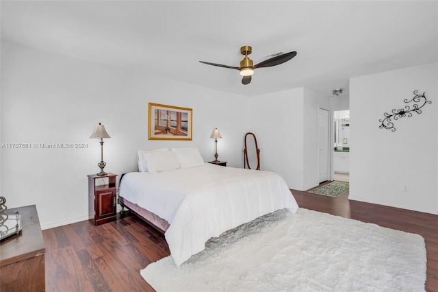 bedroom with a closet, ceiling fan, dark hardwood / wood-style flooring, and ensuite bathroom