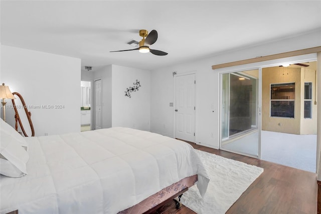 bedroom with hardwood / wood-style floors and ceiling fan