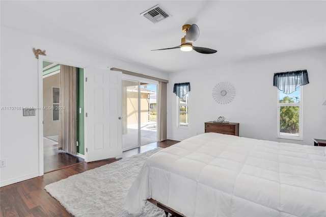 bedroom with ceiling fan, dark hardwood / wood-style flooring, and access to exterior