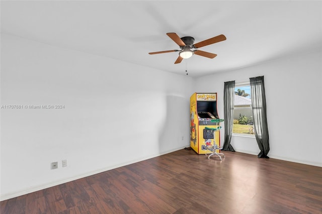 interior space with dark hardwood / wood-style flooring and ceiling fan