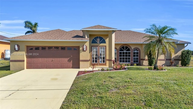 view of front of house featuring a front lawn and a garage