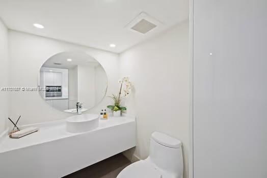 bathroom with vanity and toilet