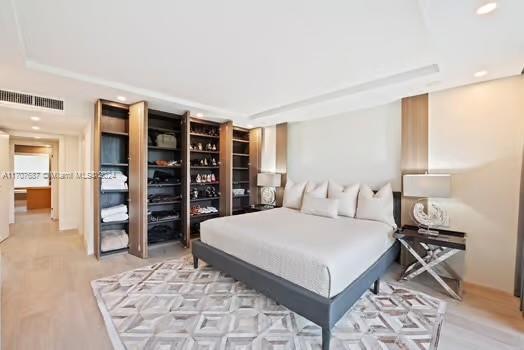 bedroom with light hardwood / wood-style flooring