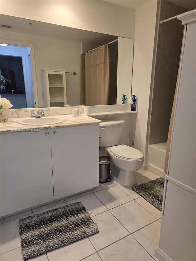 full bathroom with vanity, shower / tub combo, and toilet