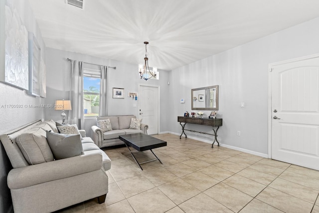 tiled living room with an inviting chandelier