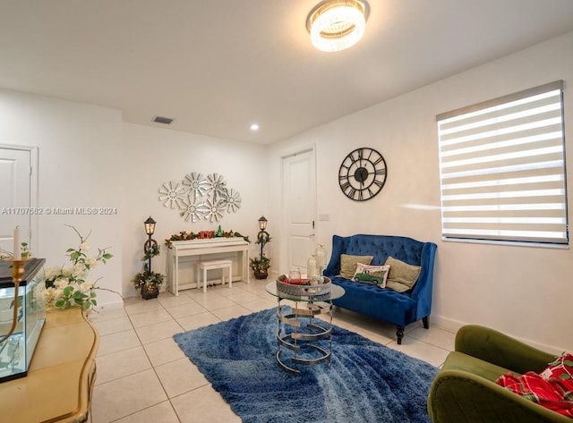 living area featuring light tile patterned flooring