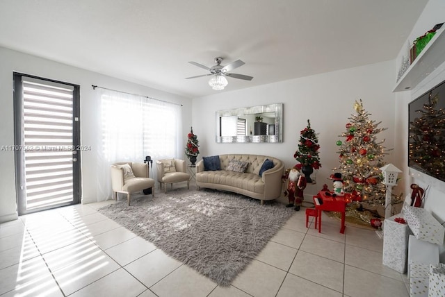 living room with light tile patterned floors and ceiling fan