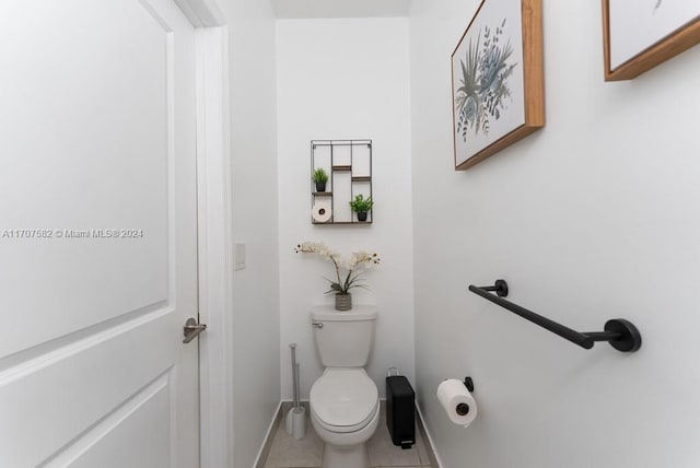 bathroom with tile patterned floors and toilet