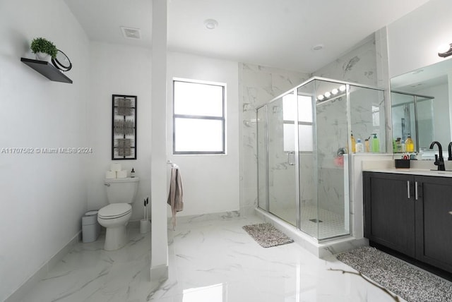 bathroom featuring vanity, toilet, and a shower with door