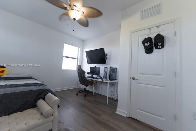 bedroom featuring ceiling fan and dark wood-type flooring