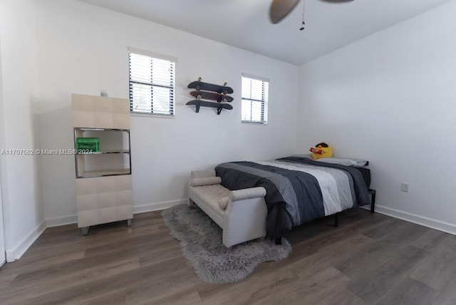 bedroom featuring ceiling fan and dark hardwood / wood-style flooring