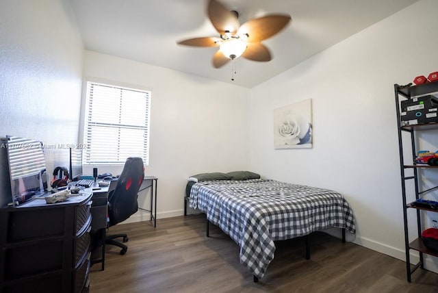 bedroom with ceiling fan and dark wood-type flooring