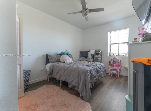 bedroom with ceiling fan and wood-type flooring