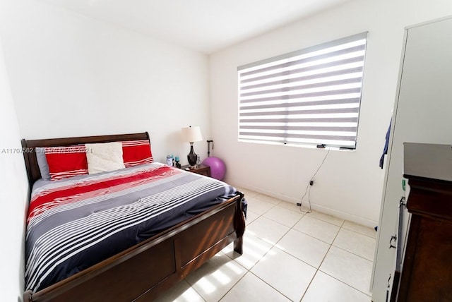 bedroom with light tile patterned floors