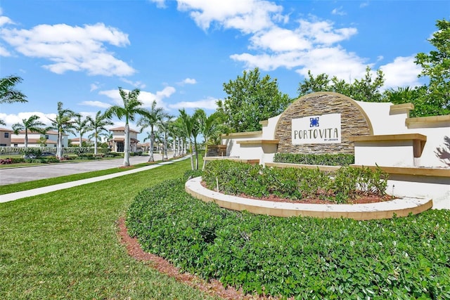 community / neighborhood sign featuring a yard