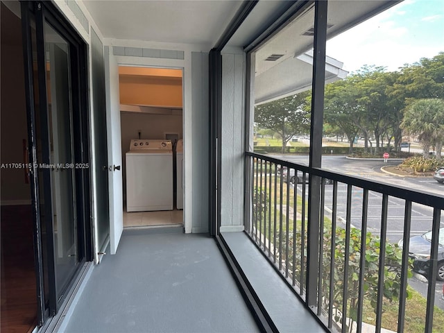 balcony with washer and dryer